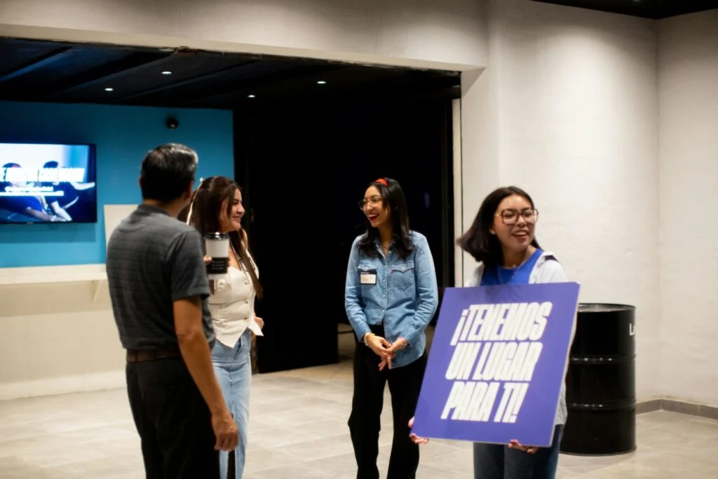 Student volunteers welcoming guests in the lobby